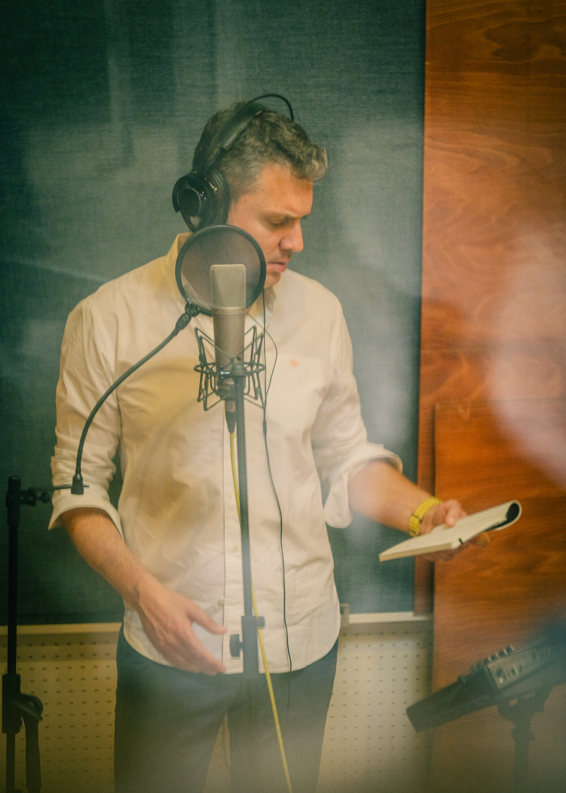 in action - reading in front of a mic